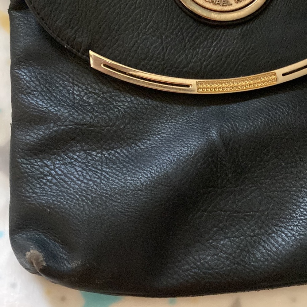 Black Michael Kors pocket book. Been used has been a good pocket book. - Picture 2 of 6